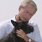US President George W. carries his dog Barney as he departs a press briefing