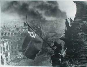 Red_army_soldiers_raising_the_soviet_flag_on_the_roof_of_the_reichstag_berlin_germany